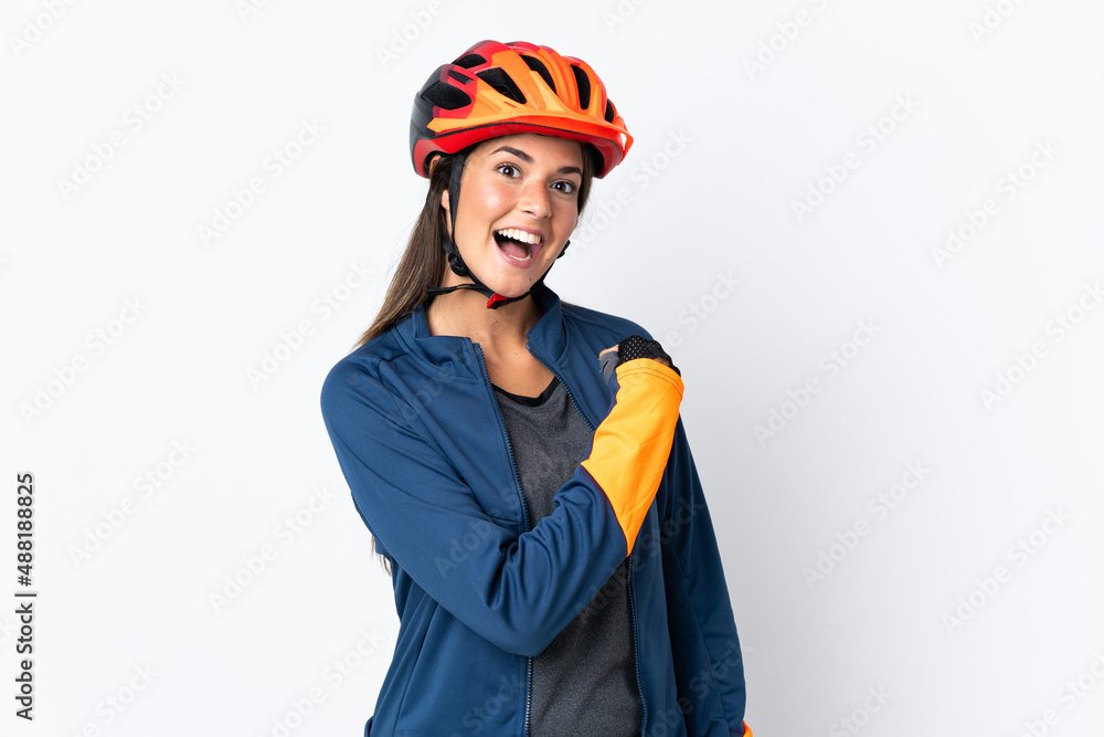 Young cyclist brazilian girl isolated on white background celebrating a victory Young cyclist brazilian girl isolated on white background celebrating a victory