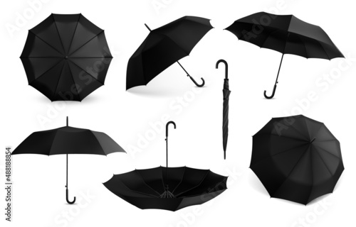 Black umbrella. Realistic mockup of open and closed rain protection accessory. View from different angles on parasol with handle. Folded waterproof tents. Vector classic canopies set photo