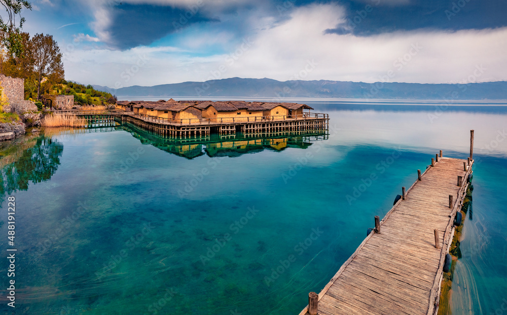 Calm morning scene of popular tourist destination - Bay of Bones. Stunning spring view of Ohrid lake. Attractive landscape of North Macedonia, Europe. Traveling concept background.