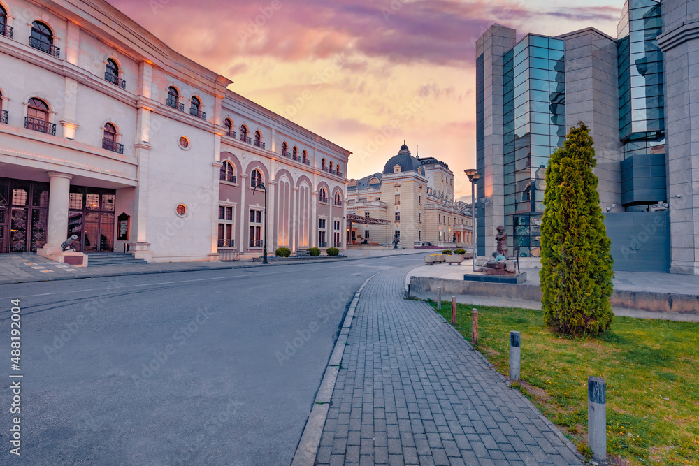 Сharm of the ancient cities of Europe. Old and modern building in Skopje town. Colorful spring sunset in capital of North Macedonia, Europe. Traveling concept background.