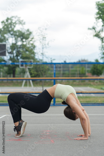 Gymnastic pose on the ground