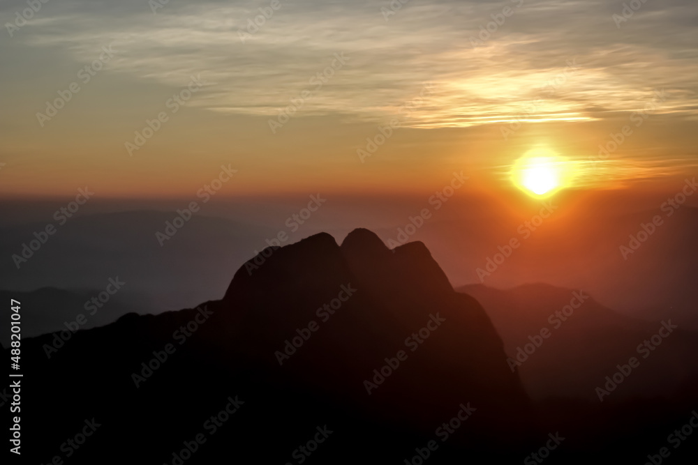 Sunset landscape on mountain at Doiluangchiangdao in Chiangmai, Thailand. Concept silhouette mountain landscape with sunlight background, Nature Wallpaper, Mountain view.