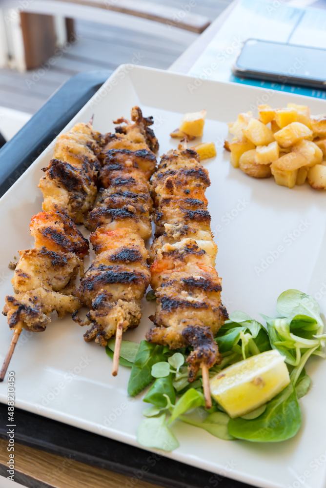 Fish skewers in the dish