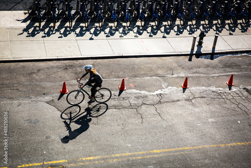 New York City street with rental bikes and a cyclist on the road see from above