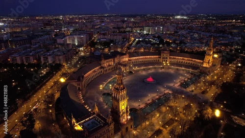 night view of Plaza de Espana in Seville, aerial view with night lights, famous Seville landmark after sunset, downtown Seville at night, drone shot of Seville skyline