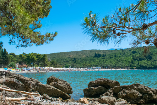 Plavi Horizonti beach landscape. Radovici. Tivat bay. Montenegro. Sandy clearest water beach excellent for kids. photo