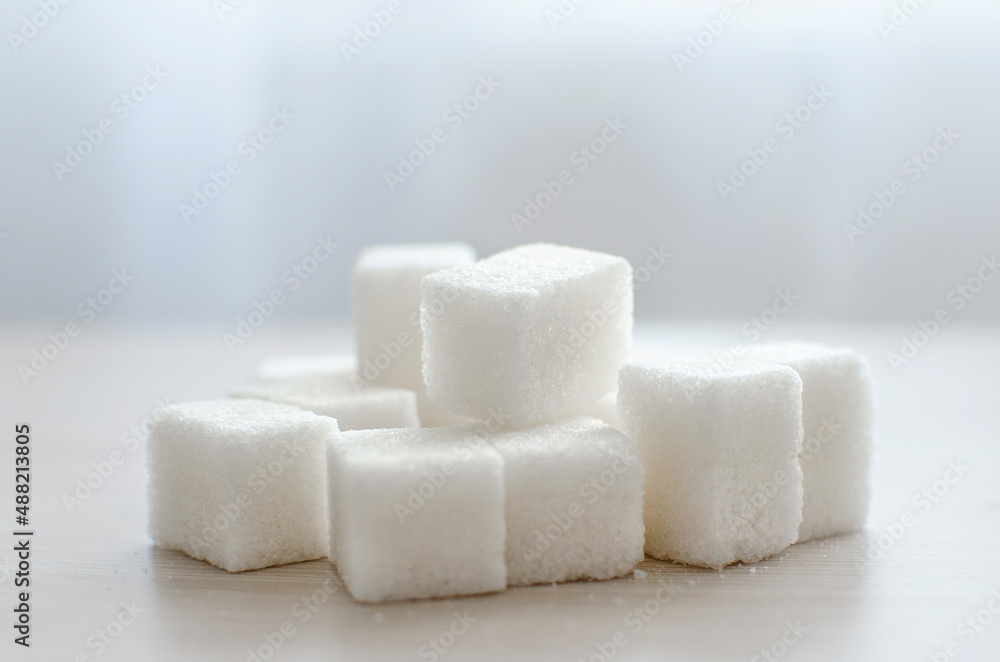 close up of sugar cubes. The concept of unhealthy eating. close up of sugar cubes. The concept of unhealthy eating.