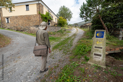 Camino de Santiago , shell mark for pilgrims to Compostela Cathedral ,Galicia, Spain - Cammino (Caminata de Santiago) Pilgrim with backpack walks along the pilgrimage photo