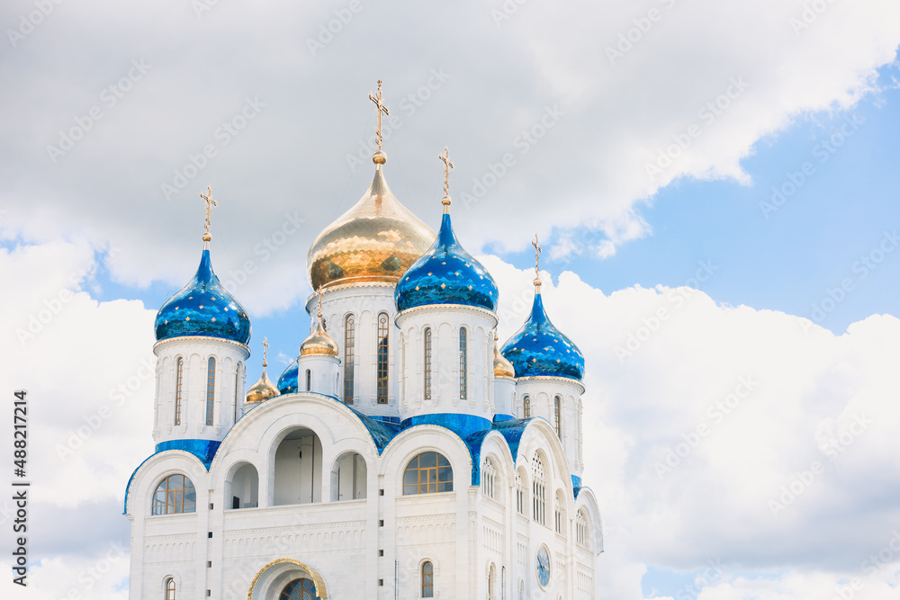 Blue and golden domes of white orthodox church Blue and golden domes of white orthodox church