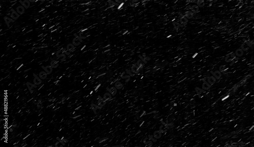 Real snowfall on a black background. Falling snow on a long exposure. Snow texture to use in graphic editor to overlay your image. Banner size