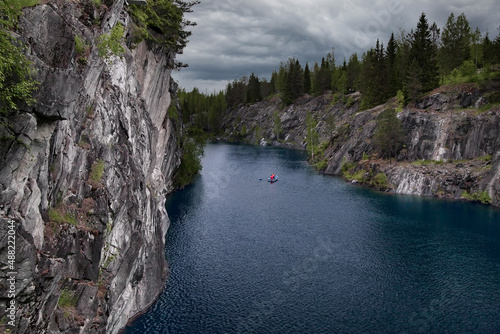 Lonely boat in the Ruskeala Marble Canyon, ‎Republic of Karelia, Russia.	