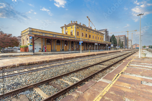 Saluzzo, Cuneo, Italy - October 19, 2021: Old railway station of the Saluzzo - Savigliano line, seen from the platforms of the tracks photo