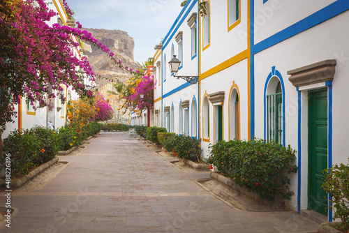 Street with bougainvillea flowers in Puerto Mogan, Gran Canaria island, Spain photo
