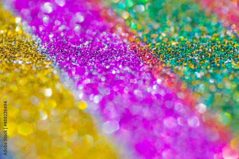 Blurred glitter background, bright colors, pink, purple, blue