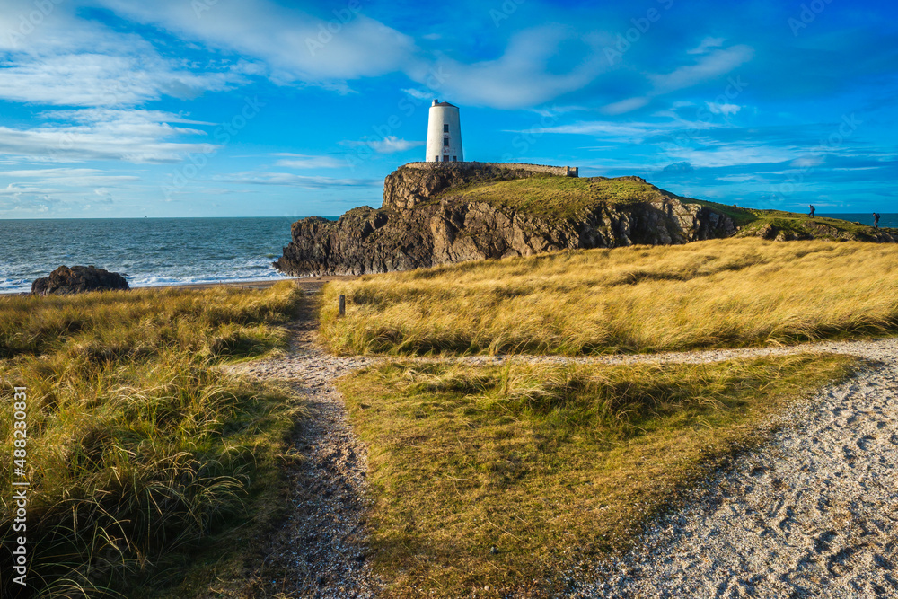 Lighthouse on Llanddwyn Island near Newborough on the Anglesey coast in Wales, UK