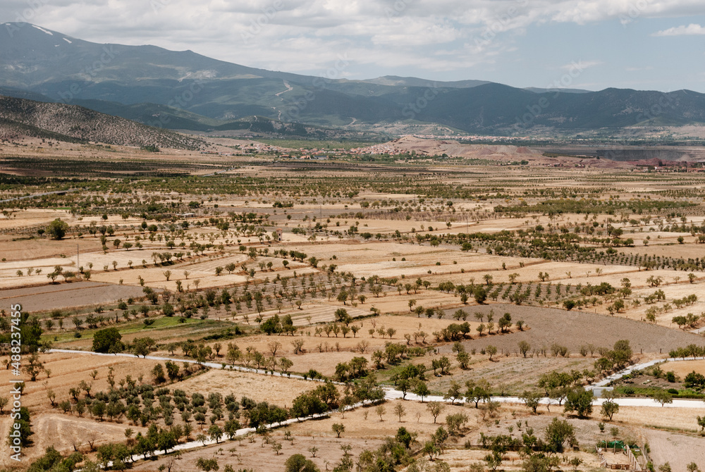 Aerial view of the rural area of southern Spain (La Calahorra). There are cultivated fields of cereals and some trees. Sierra Nevada (Granada) can be seen in the background on the horizon.