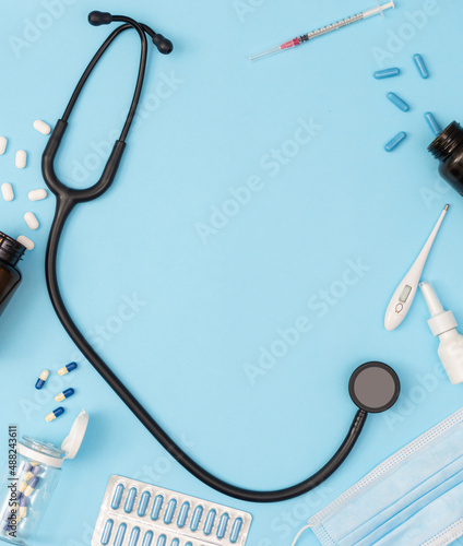 Medical devices on a blue background. Medical business cover concept. Copy space, flat lay, top view