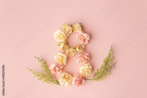 March 8th. Happy Women's Day. Creative layout. Composition in the form of the number eight of rosebuds on a pink background