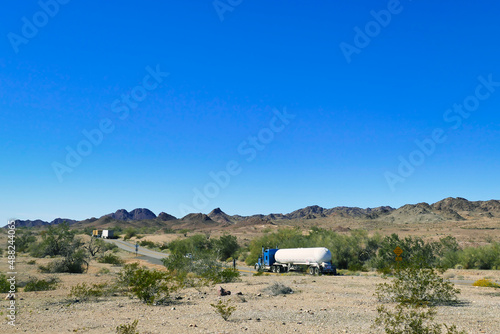 Trucks on a desert road. Highway 62 near Parker, San Bernardino County, California, USA 