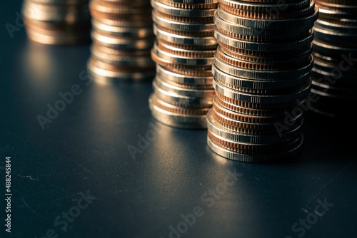 Pile of gold coins money stack in finance treasury deposit bank account saving . Concept of corporate business economy and financial growth by investment in valuable asset to gain cash revenue . photo