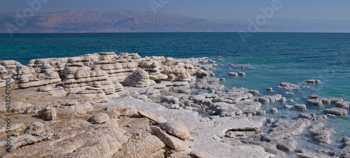 Bizarre salt deposits in the Dead Sea coast, Earth's lowest elevation on land. Unique coastline, natural salt formations and patterns, salt stalagmites in the Dead Sea shore. 