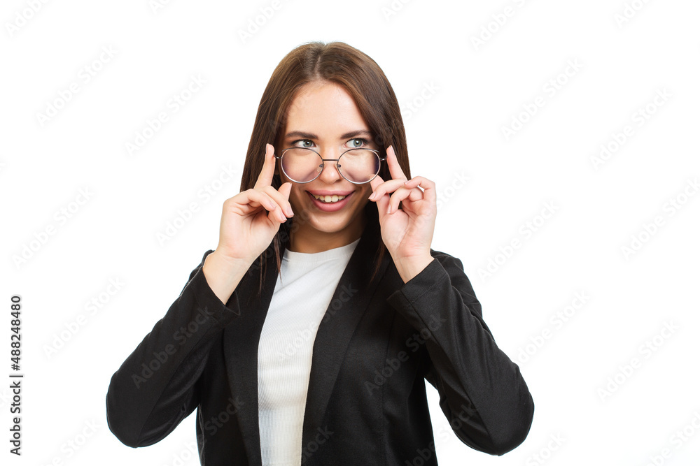 Young girl smiling and adjusting glasses. Businesswoman clothing style.