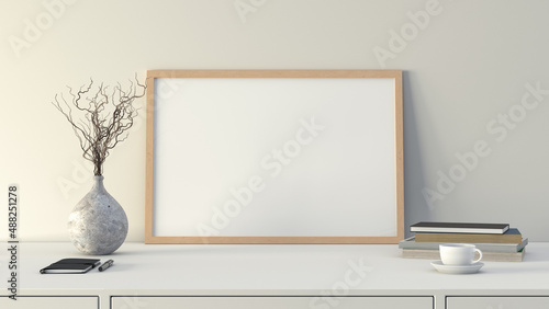 Horizontal wooden picture poster frame mock up. Cup of coffee, books, vase and notebook on white table. White wall background.