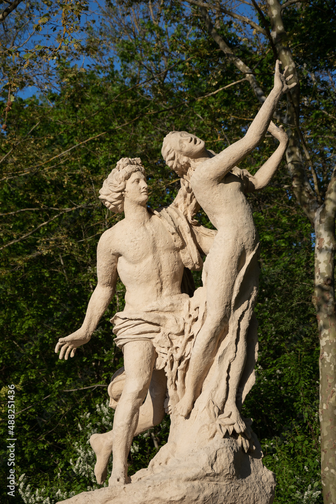 Coercing, women sexual abuse concepts. Chastity and sexual desire. Apollo and Daphne park sculpture.
