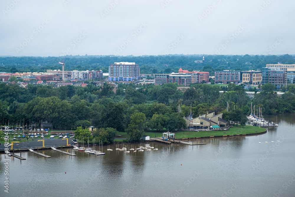 Aerial view of Alexandria cityscape in Northern Virginia cloudy day near Washington DC Potomac river with Marina sailing club island