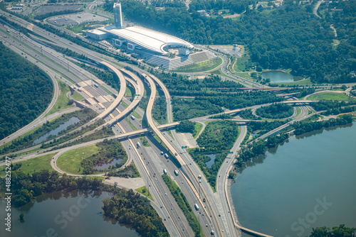 Aerial drone airplane view of cityscape near Oxon Hill in Washington DC with i495 highway capital beltway outer loop with traffic cars and buildings photo