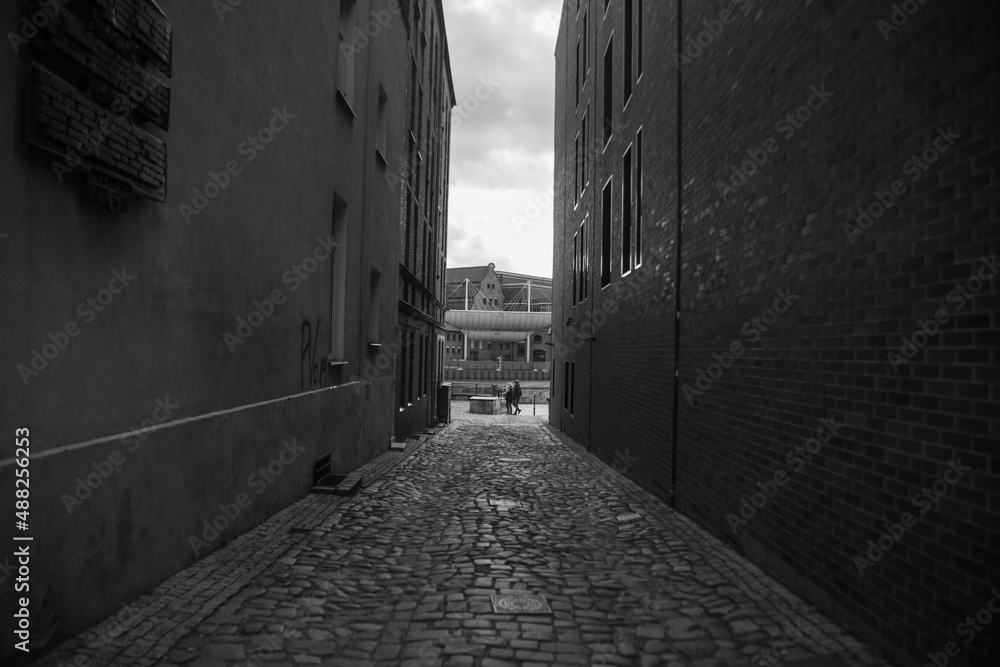 Obraz premium Narrow street in Europe in Stockholm without people during the day with a paved road