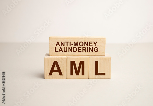 Word aml written in wooden blocks. Business concept photo