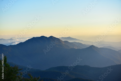 mountain peak at sunset © tharathip