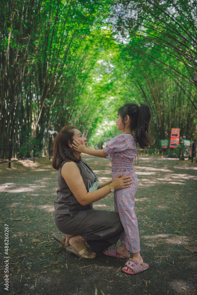 family in Bamboo tunnel of Wat Chulabhorn Wanaram Temple family in Bamboo tunnel of Wat Chulabhorn Wanaram Temple