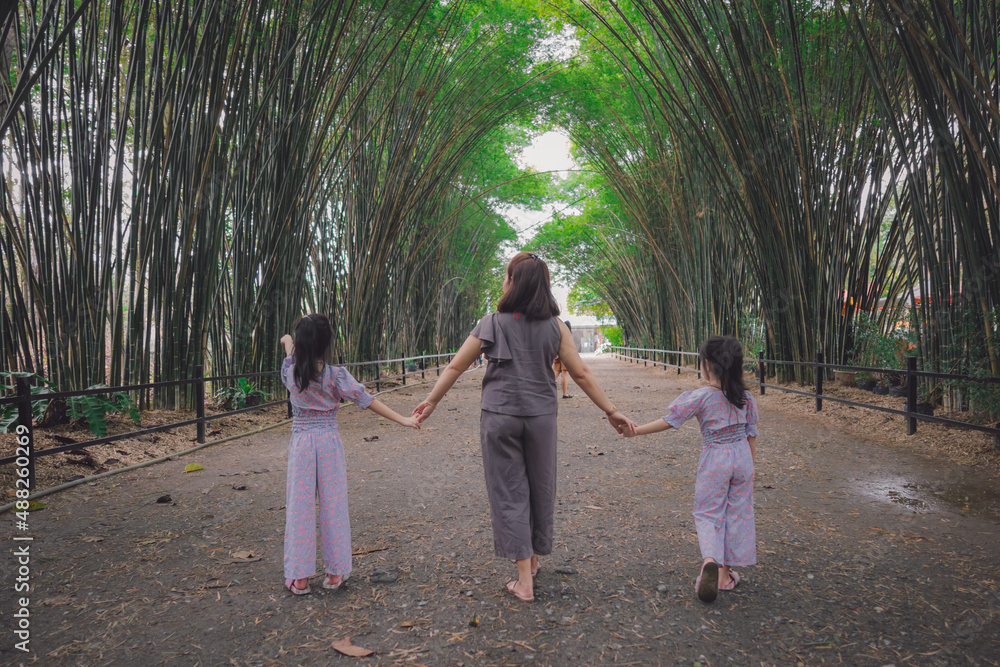 family in Bamboo tunnel of Wat Chulabhorn Wanaram Temple family in Bamboo tunnel of Wat Chulabhorn Wanaram Temple