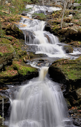 Scenic waterfall near Wilton, New Hampshire. Portion of Garwin Falls cascading down steep rocky ravine located just upstream from main waterfall.