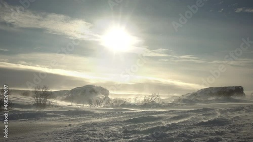 Heavy blizzard on Icelandic country road winter day photo