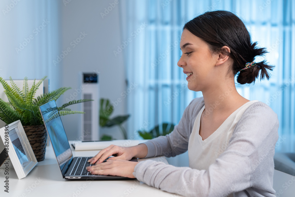 Asian young woman study virtual online and work in living room at home. Asian young woman study virtual online and work in living room at home.
