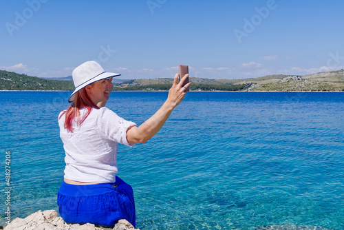 happy beautiful young woman enjoying freedom and the sea view, summer vacation concept