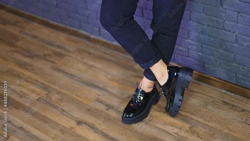 Slow motion lifestyle stylish footwear. Close up view of shoes on the floor. Slow motion lifestyle stylish footwear. Close up view of shoes on the floor.