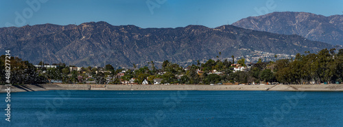 Panoramic view of Silver Lake in downtown Los Angeles with birds flying across the lake in spring