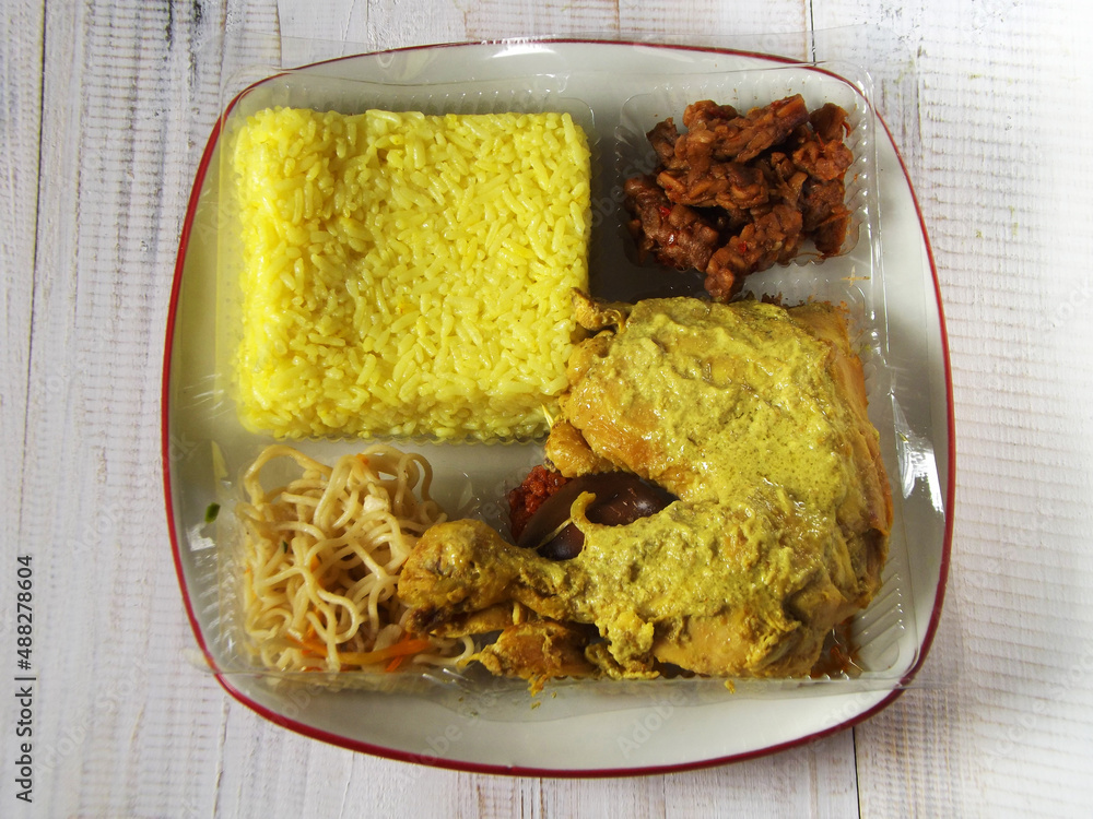 Foto Stock Set menu of yellow rice or nasi kuning is Indonesian
