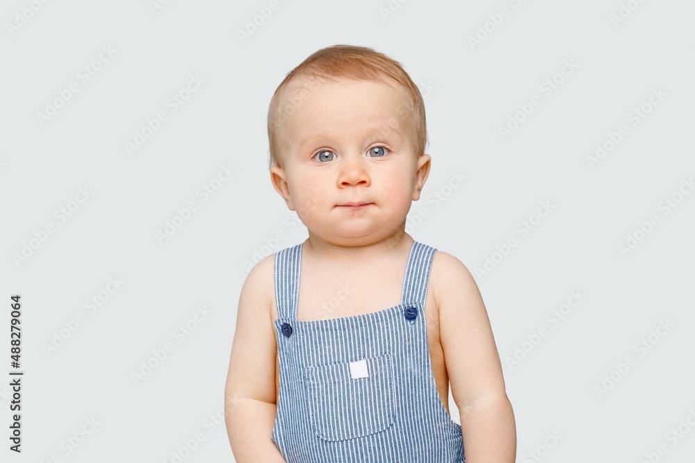 Portrait of a baby with blue eyes on a light background, white background for advertising Portrait of a baby with blue eyes on a light background, white background for advertising