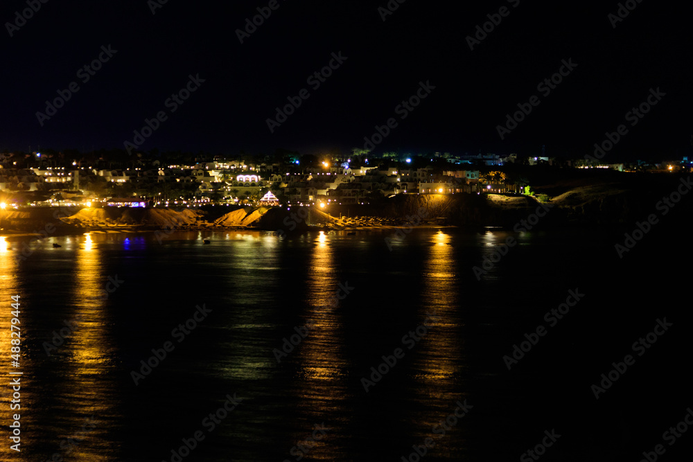 View of Naama Bay in Sharm El Sheikh, Egypt at night. View from above View of Naama Bay in Sharm El Sheikh, Egypt at night. View from above