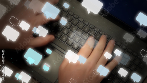 Blurred man hands typing messages on laptop keyboard. Lot of speech bubbles fly away. Chat background, 3d rendering.