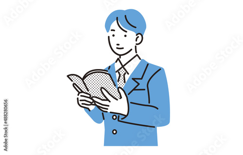 本を読む高校生の男の子
