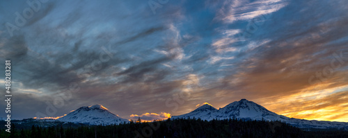 A panorama winter sunset over Three Sisters mountains in Bend Oregon