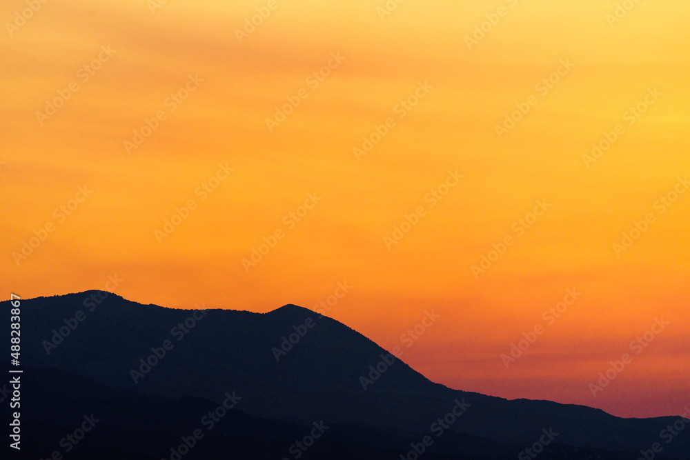 Afterglow in hilly terrain - Twilight with mountains in the foreground