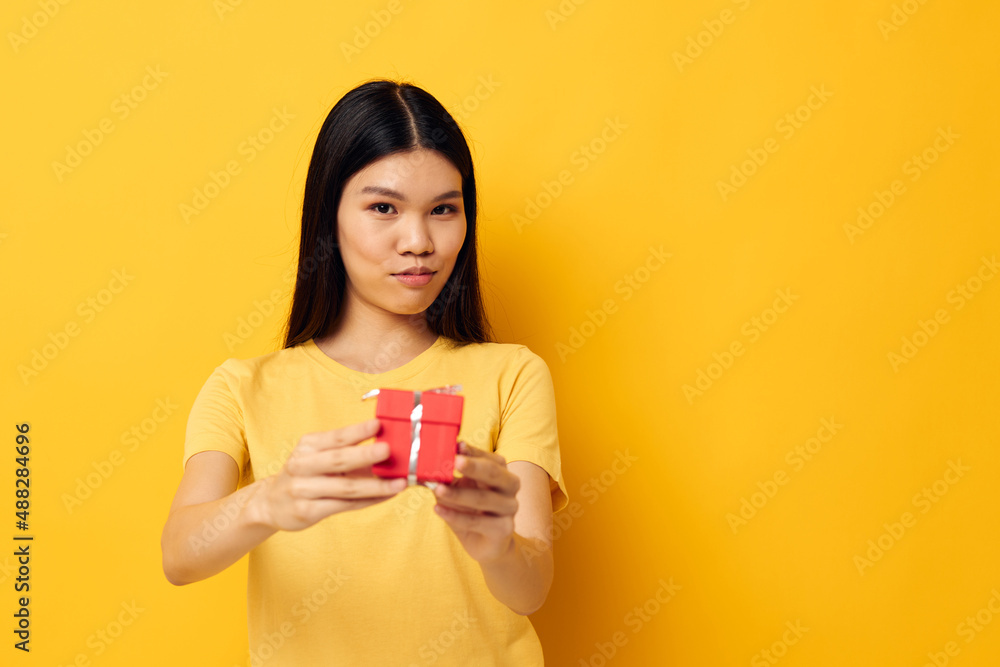 Portrait Asian beautiful young woman Little red gift box fun isolated background unaltered Portrait Asian beautiful young woman Little red gift box fun isolated background unaltered