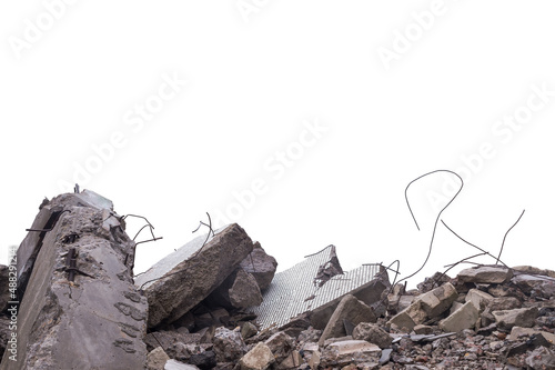 Grey concrete fragments of a destroyed building isolated on a white background. The cut object